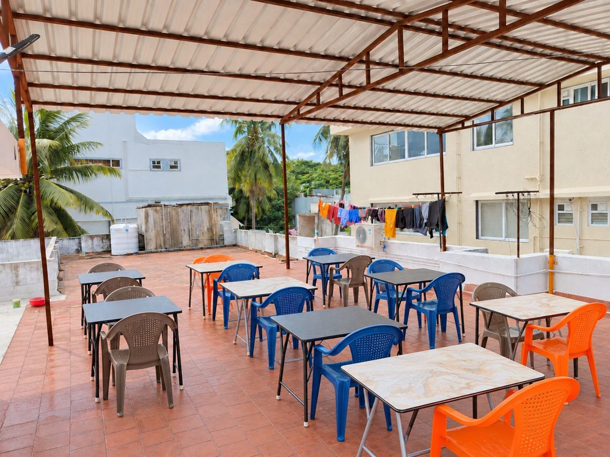 Covered terrace with tables and chairs